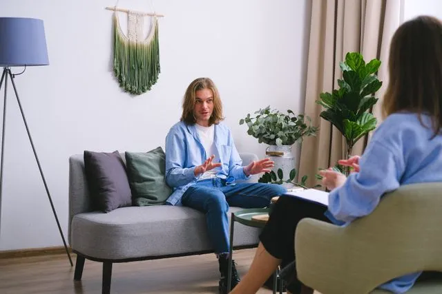 Student discussing GRE preparation plan with education counselor
