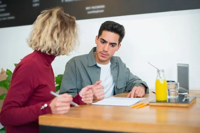 Student discussing an IELTS preparation study plan with a tutor